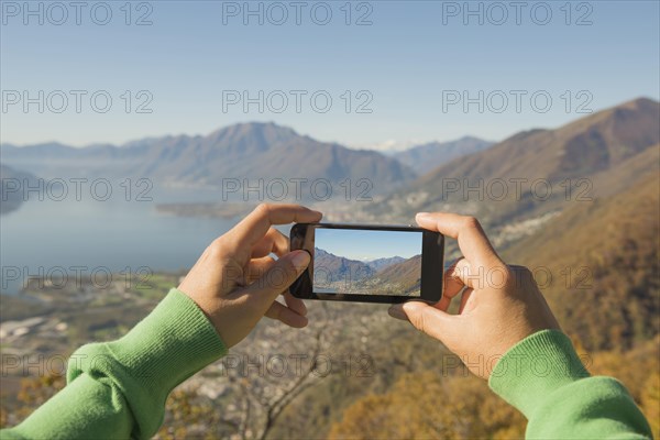 Woman taking a photo with a mobile phone