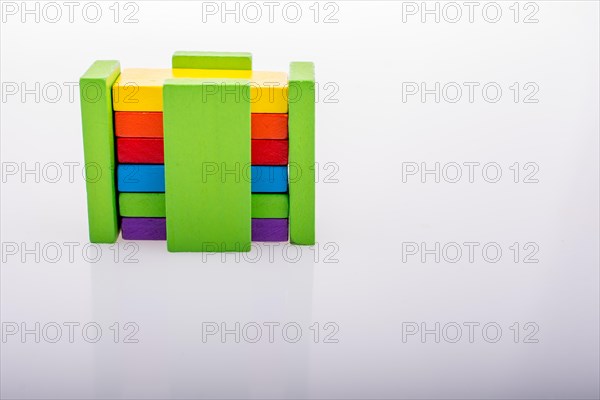 Colorful Domino Blocks in a line on a white background