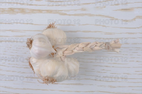 Cloves of garlic placed on a wooden texture