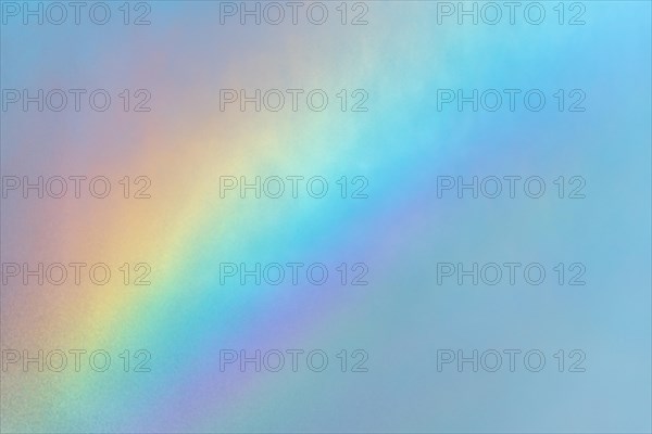 Rainbow colours in the water flow of an agricultural sprinkler system. Bas-Rhin