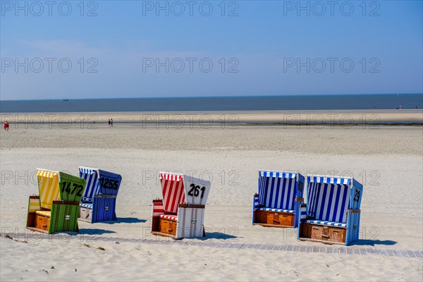 Colourful beach chairs on the beach on the North Sea island of Langeoog