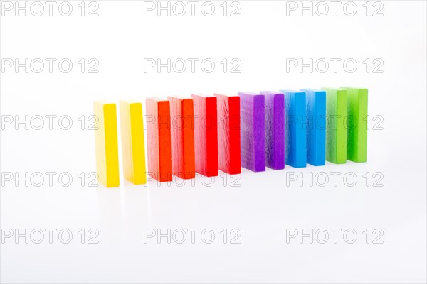 Colorful Domino Blocks in a line on a white background