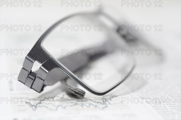 Financial Newspaper and Eyeglasses