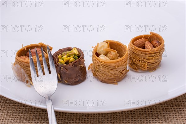 Nut stuffed dessert of mini size cuisine on a plate