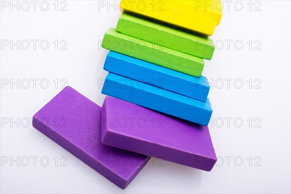 Colorful Domino Blocks in a line on a white background