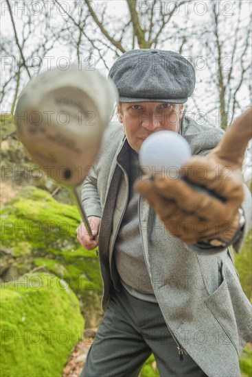 Golfer showing golf ball