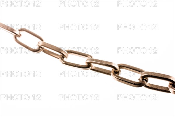 Gold color metal chain on white background