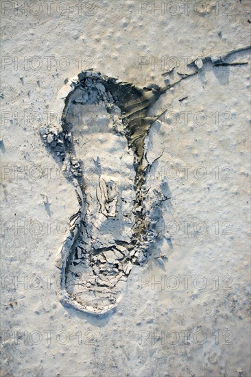 Footstep pattern seen on a concrete background