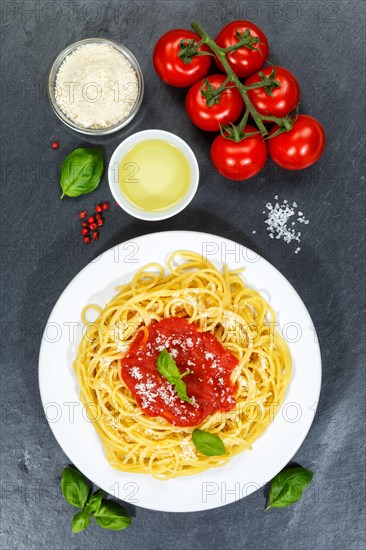 Spaghetti eat Italian pasta lunch dish with tomato sauce from top of slate in Stuttgart