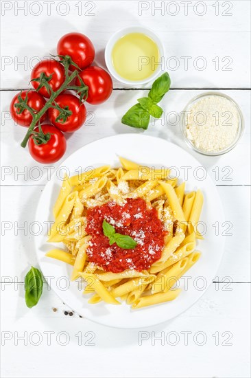 Penne Rigatoni Rigate Italian pasta in tomato sauce eat lunch dish on plate from above in Stuttgart