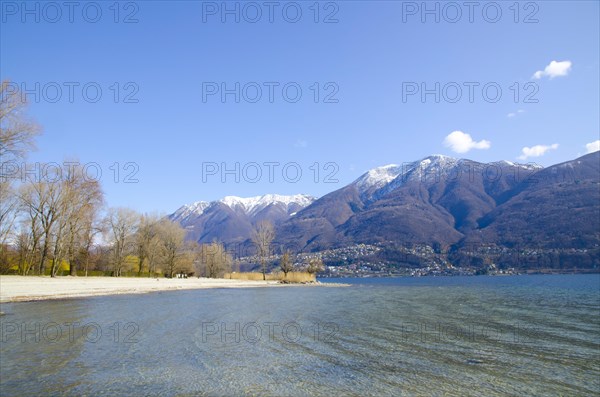 Beach with Snow-capped Mountain in Ascona