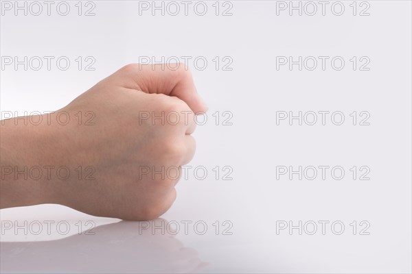 Clenched fist hand on a white background