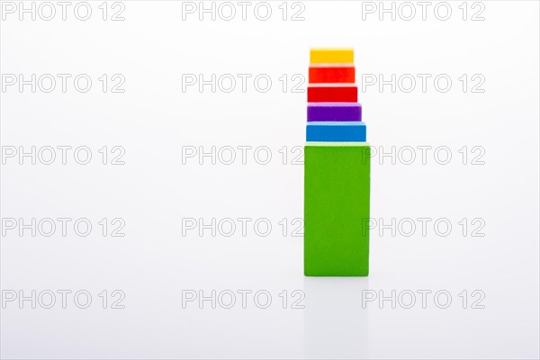 Colorful Domino Blocks in a line on a white background