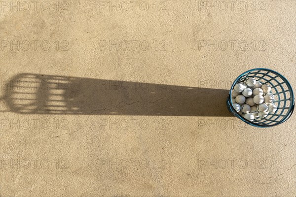 Driving Range Basket with Golf Balls and Shadow