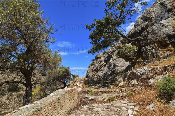 Typical Greek or Cretan landscape. Paved stairs down the hills and mountains