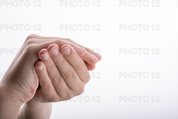 Closed Hand holding on a white background