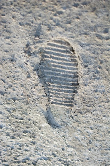 Footstep pattern seen on a concrete background