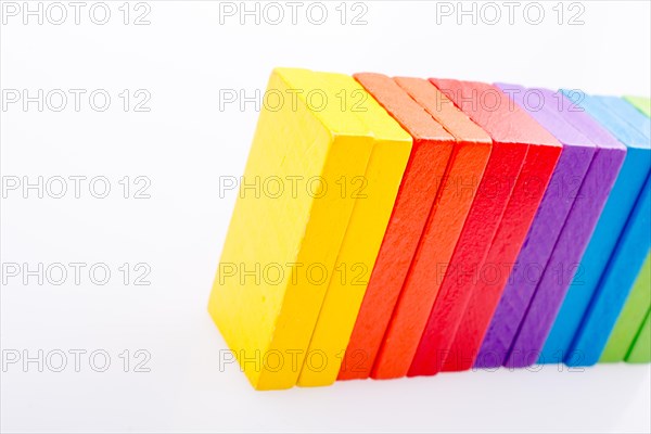 Colorful Domino Blocks in a line on a white background