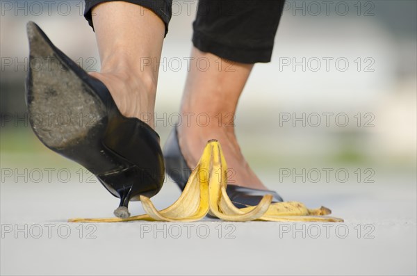 Woman with High Heels Shoes Walking on Banana Peel