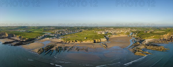 Aerial panorama of the coastline of Bude Bay at low tide