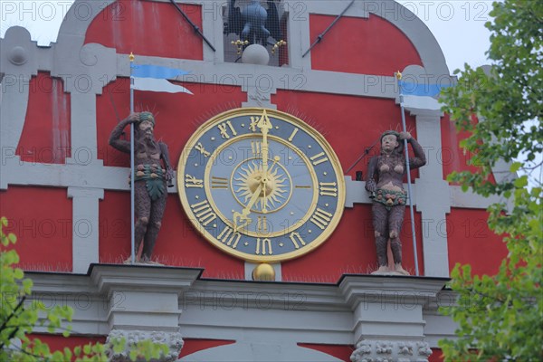 Gable of the town hall with clock and figures