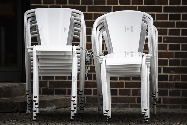 Chairs are lined up in front of a restaurant in Berlin