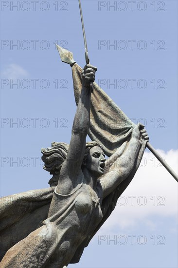 Woman with raised sword and flag
