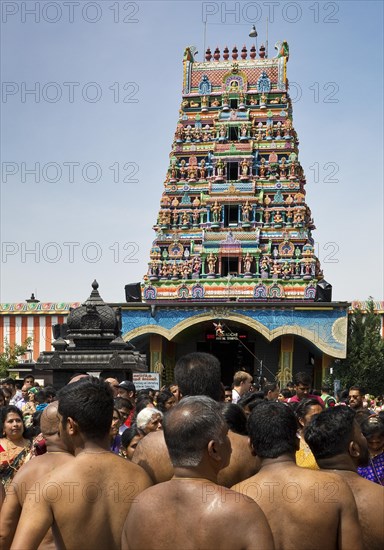 Hindus on the main festival day at the temple festival in front of the Hindu temple Sri Kamadchi Ampal