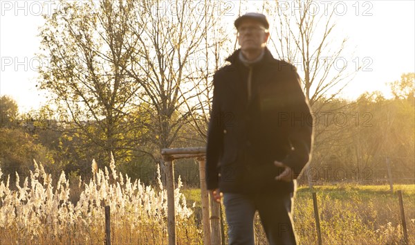 Man goes for an autumn walk alone