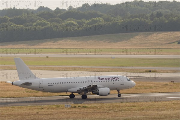Passenger aircraft Airbus A320-214 of the airline Eurowings on the tarmac at Hamburg Airport