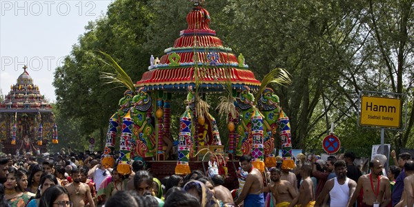 Hindus on the main festival day at the big parade Theer in front of the town sign of Hamm Uentrop