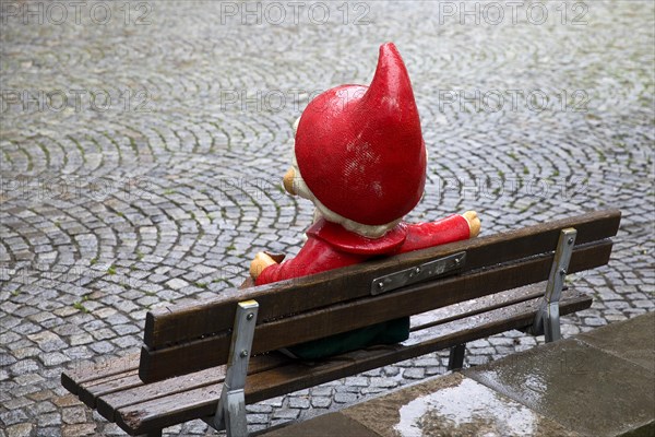 Sculpture of the Sandman on a bench