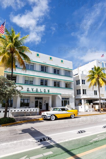 Avalon Hotel in Art Deco style architecture and vintage car on Ocean Drive in Miami Beach