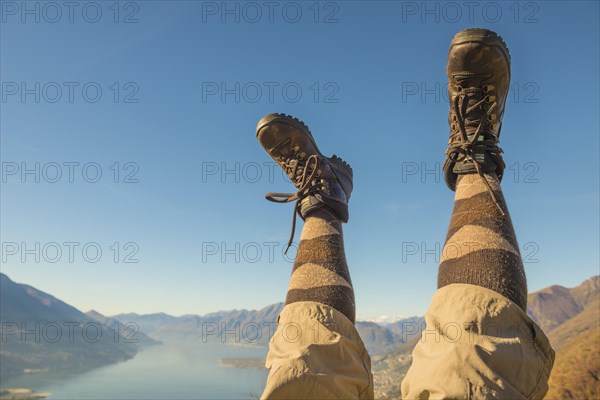 Hiking shoes and legs up in the air