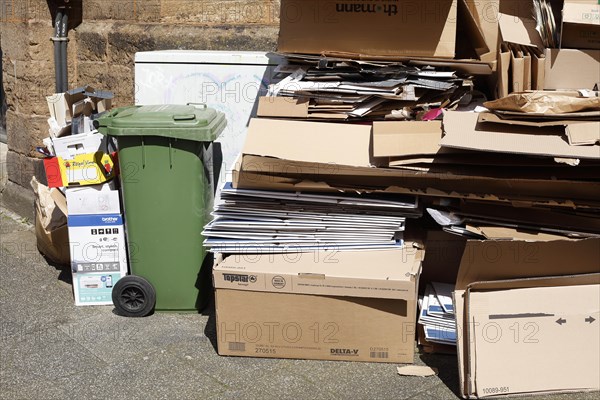 Cartons and stacks of waste paper