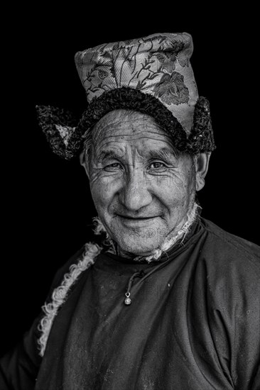 Elderly man in traditional Ladakhi clothes