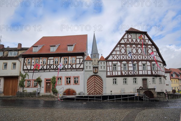 Historic home playhouse and church tower of St. Maria Magdalena