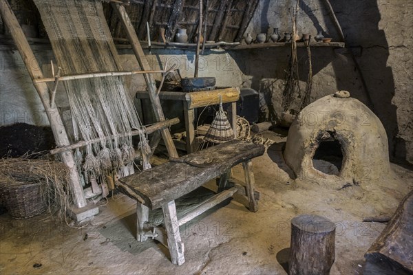 Interior of 1th century BC Gallic house showing vertical loom and oven at the open-air Archeosite and Museum of Aubechies-Beloeil