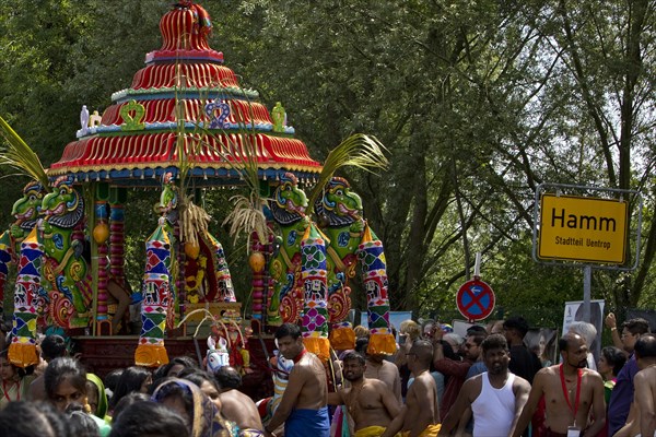 Hindus on the main festival day at the big parade Theer in front of the town sign of Hamm Uentrop