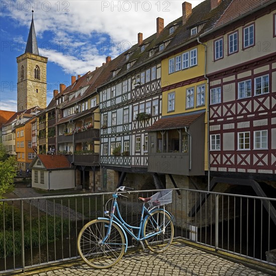 Half-timbered houses of the Kraemerbruecke with the river Gera and the Aegidienkirche