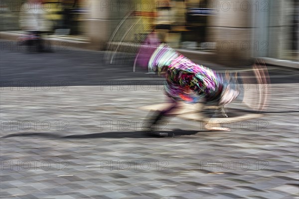 Colourful clown doing a cartwheel