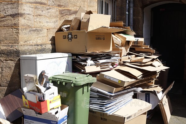 Cartons and stacks of waste paper