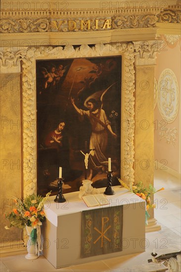Interior view with altar and painting of baroque St. Trinitatis Church