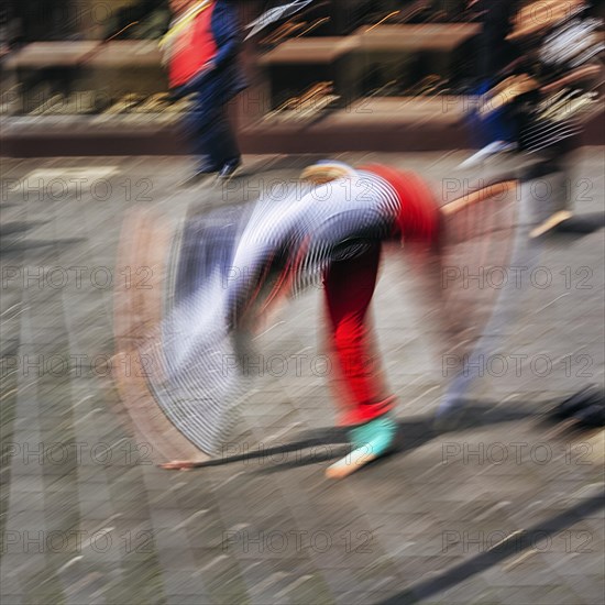 Colourful clown beats a wheel