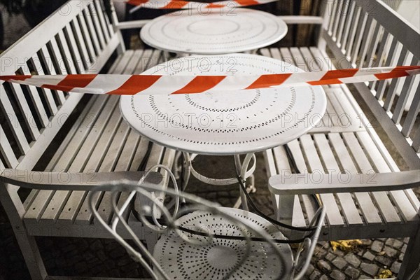 Barricaded tables and benches at a cafe in Berlin