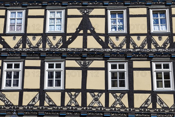 Details on magnificent half-timbered house with ornate wood carving