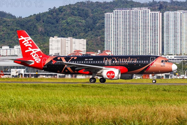 An AirAsia Airbus A320 aircraft with registration 9M-AQM and De'Xandra special livery at Penang Airport