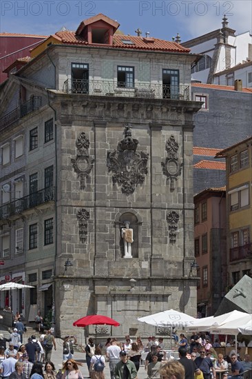 Monumental fountain Fonte da Praca da Ribeira with modern sculpture St. John the Baptist