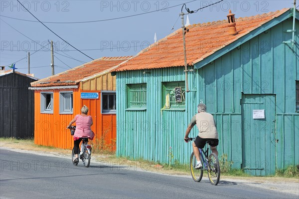 Colourful cabins of oyster farm at la Baudissiere near Dolus