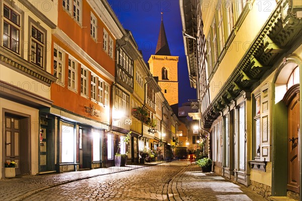 Half-timbered houses of the Kraemerbruecke with the Aegidienkirche in the evening